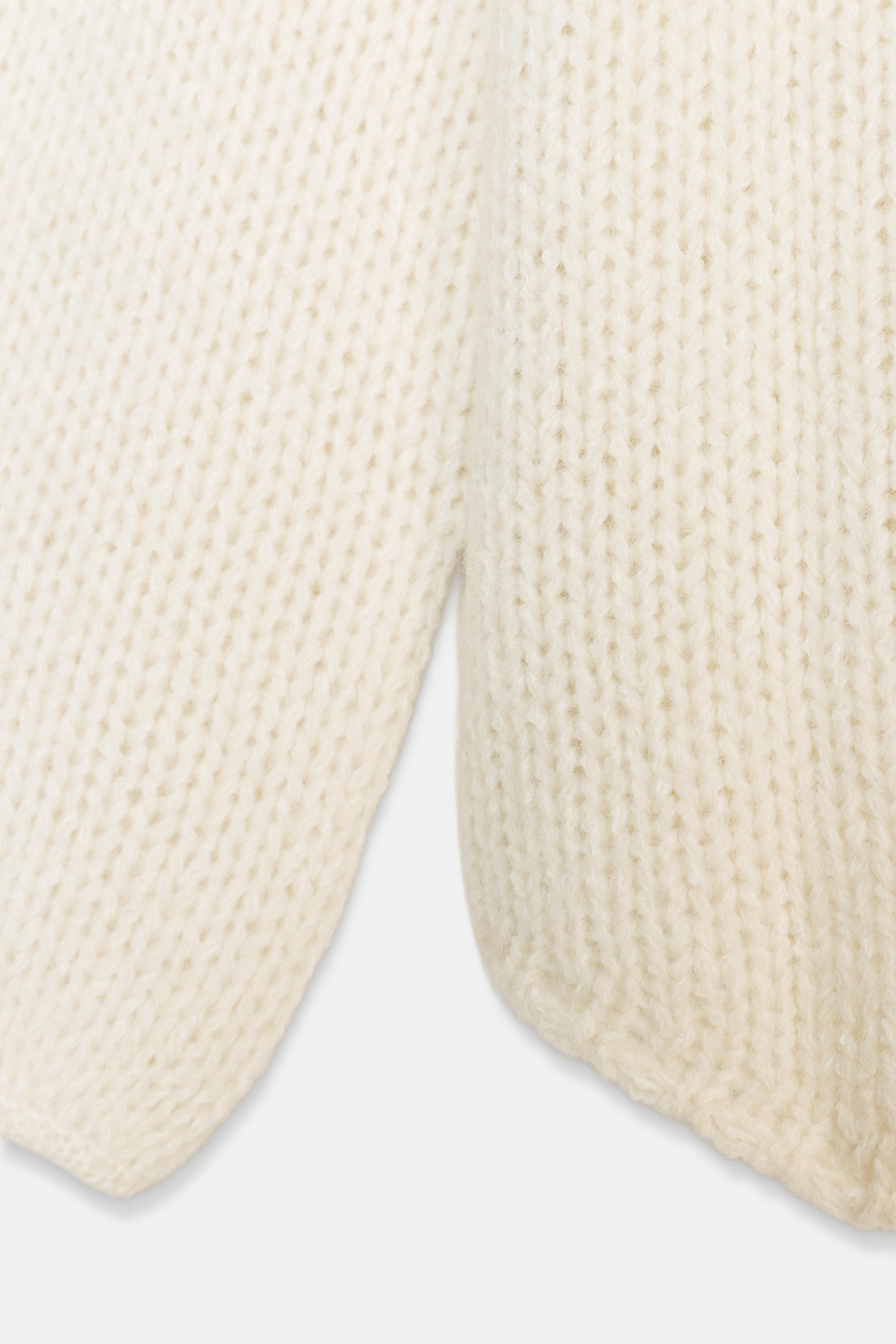 PULL EN MAILLE À BAS ASYMÉTRIQUE